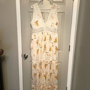 Brand New with Tags. White Maxi Dress with yellow and orange flowers. Rue 21 XL